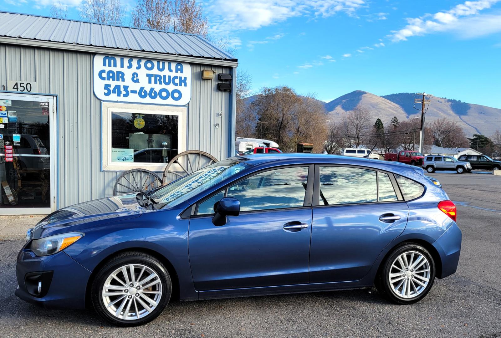 2012 Blue /Black Subaru Impreza Limited 5-Door (JF1GPAG65CH) with an 2.0L H4 DOHC 16V engine, Continuously Variable Transmission transmission, located at 450 N Russell, Missoula, MT, 59801, (406) 543-6600, 46.874496, -114.017433 - Good Runner. Excellent MPG. Automatic Transmission. Heated Seats. Air. Cruise. Tilt. Bluetooth. has Timing Chain. Not a Timing Belt. - Photo#0